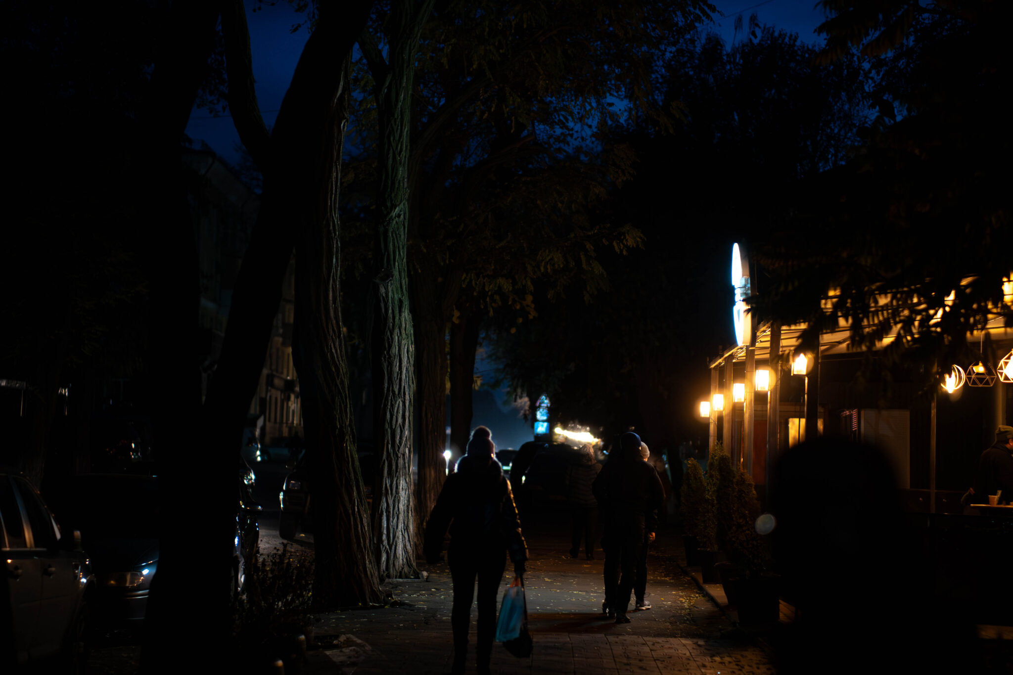 Kramatorsk street during a blackout, only shops have their lights turned on due to generators