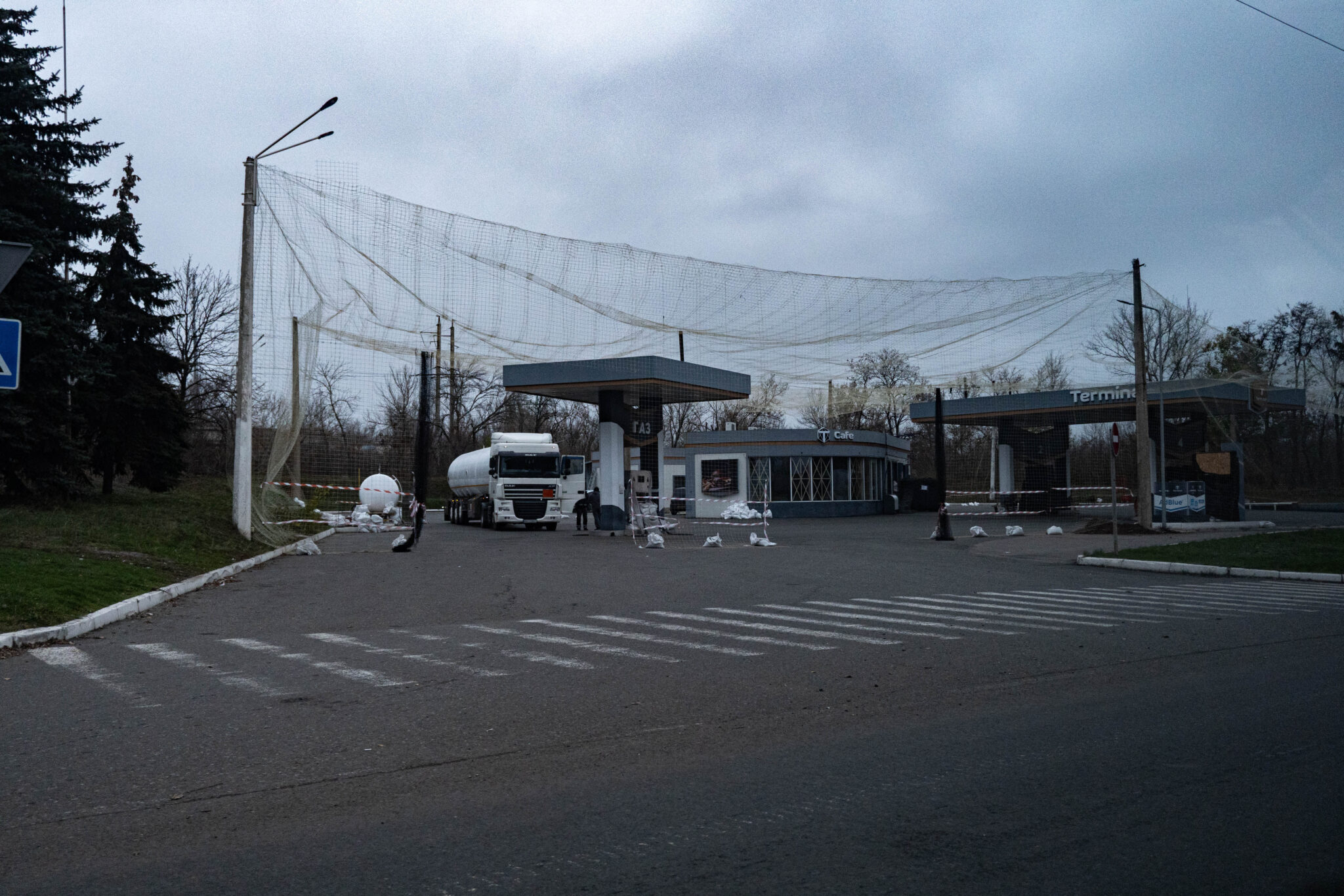 Gas station on the outskirts of the city, operating under its own drone net protection